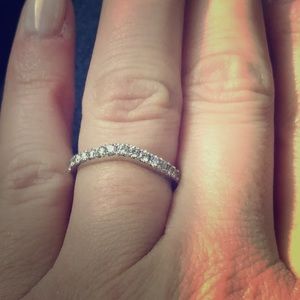 Platinum diamond curved wedding band.